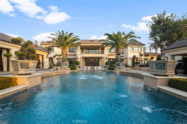 view of pool with pool water feature