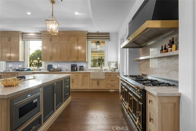 kitchen with exhaust hood, backsplash, decorative light fixtures, dark wood-type flooring, and high end stainless steel range