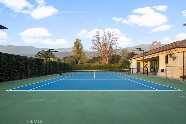 view of sport court with basketball court and a mountain view