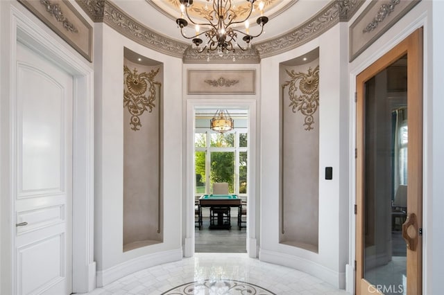 entryway featuring ornamental molding