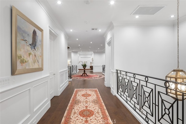 corridor featuring dark hardwood / wood-style floors and ornamental molding