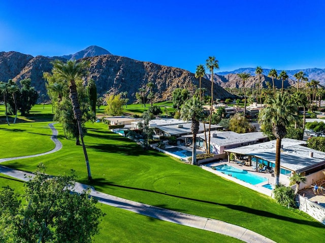 view of community with a mountain view and a swimming pool