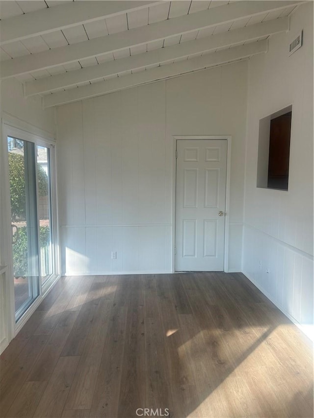 unfurnished room featuring wooden ceiling, hardwood / wood-style flooring, and lofted ceiling with beams