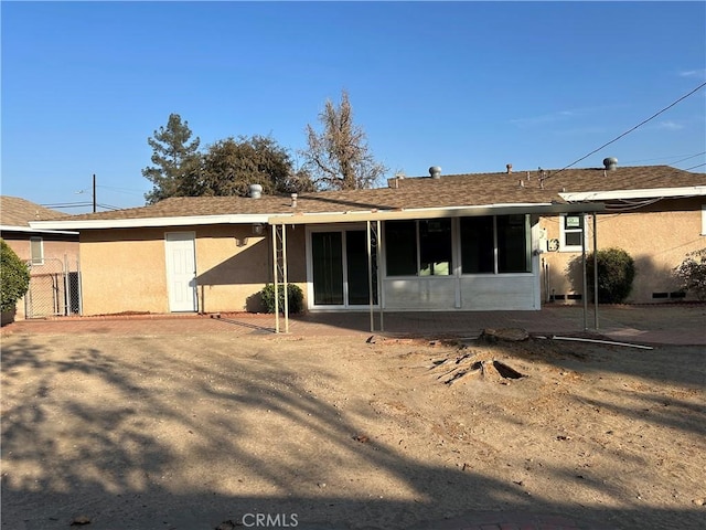 back of house with a patio area