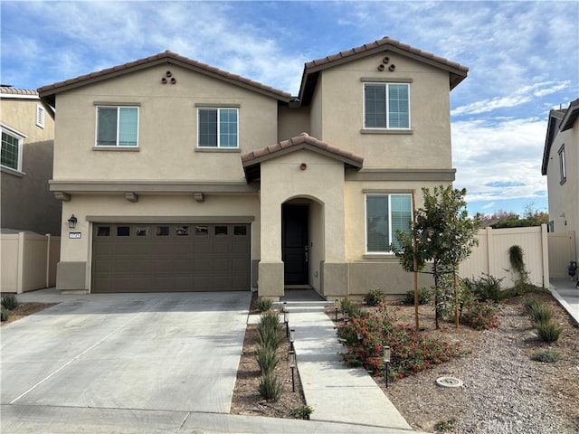 mediterranean / spanish-style home with a garage