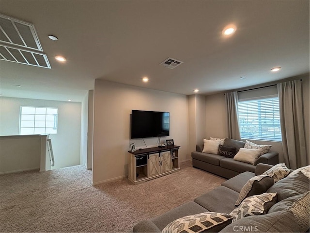 carpeted living room featuring a healthy amount of sunlight