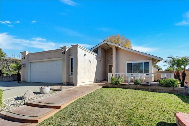 view of front of property with a front yard, a garage, and a porch