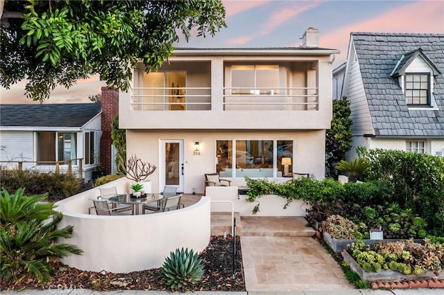 view of front of home with a balcony