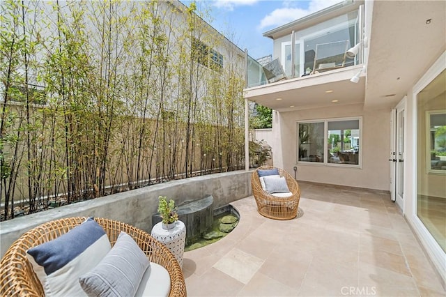 view of patio / terrace featuring a balcony