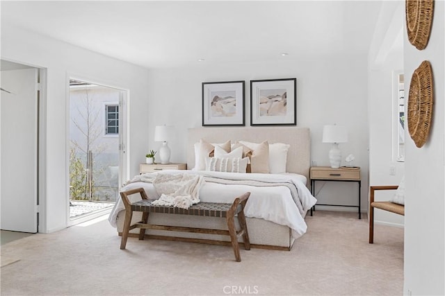 carpeted bedroom featuring access to exterior