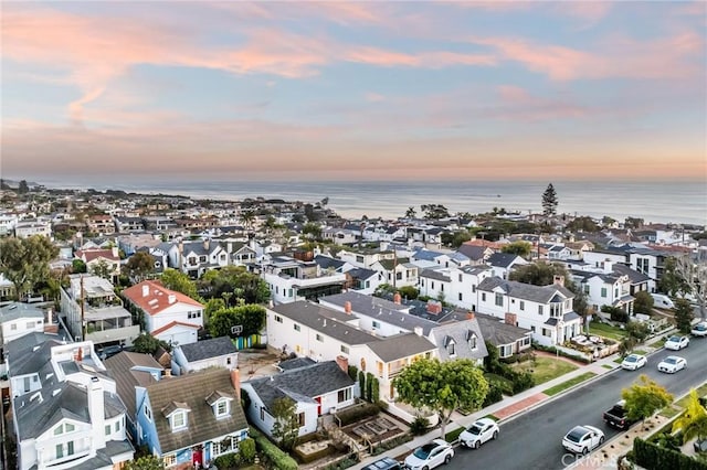 aerial view at dusk with a water view