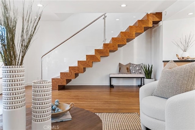 stairway with hardwood / wood-style floors