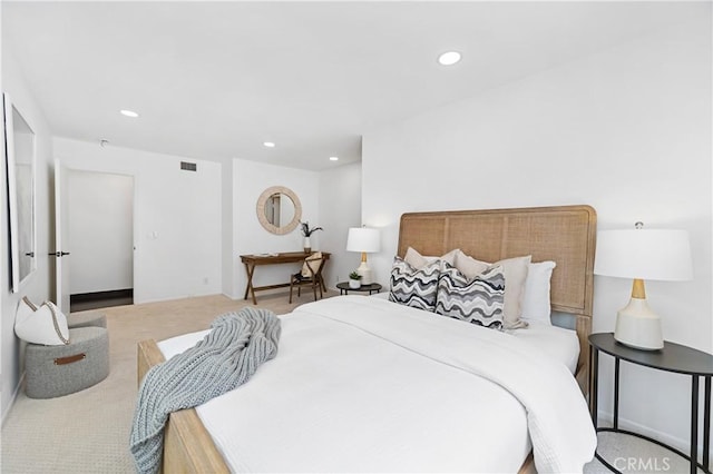 bedroom with light colored carpet