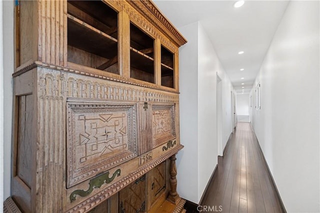 corridor featuring dark wood-type flooring