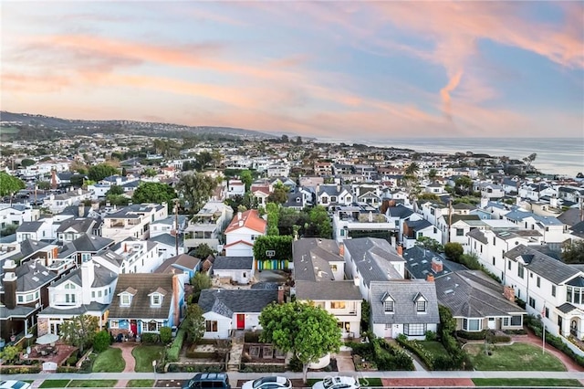 aerial view at dusk with a water view