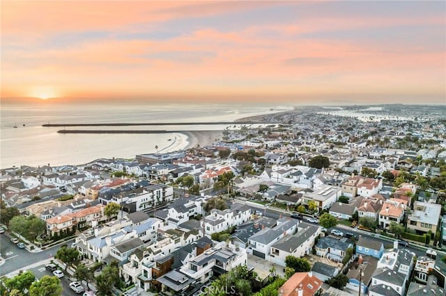 aerial view at dusk with a water view