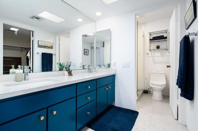 bathroom featuring toilet and vanity