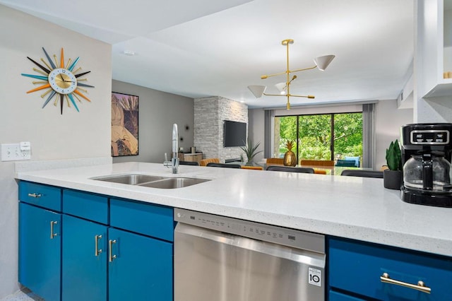 kitchen featuring blue cabinetry, dishwasher, a chandelier, light stone counters, and sink