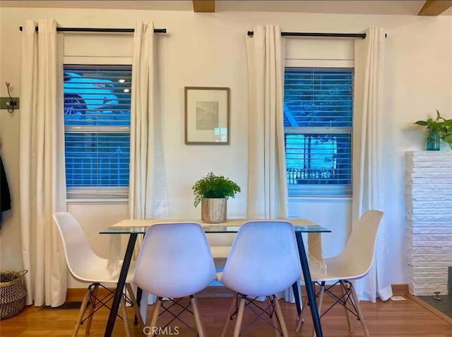 dining area with hardwood / wood-style floors