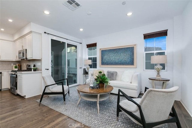 living room with dark hardwood / wood-style floors