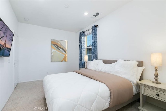 bedroom with light colored carpet