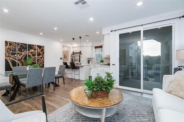 living room with light hardwood / wood-style flooring