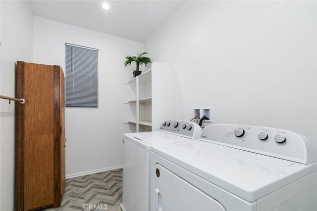 clothes washing area with washing machine and clothes dryer