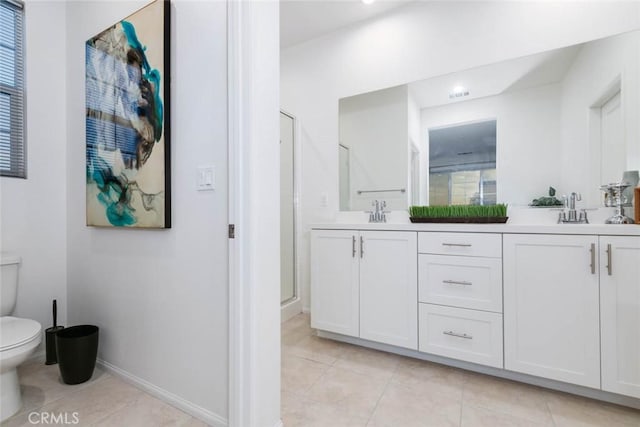 bathroom with toilet, tile patterned flooring, a shower with door, and vanity