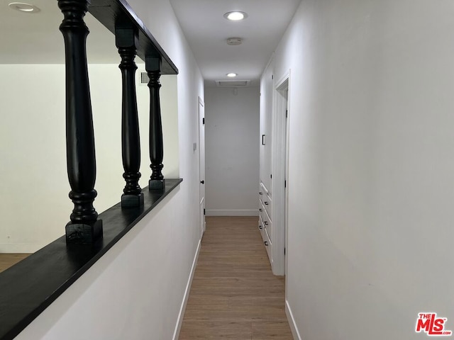 corridor featuring light hardwood / wood-style floors