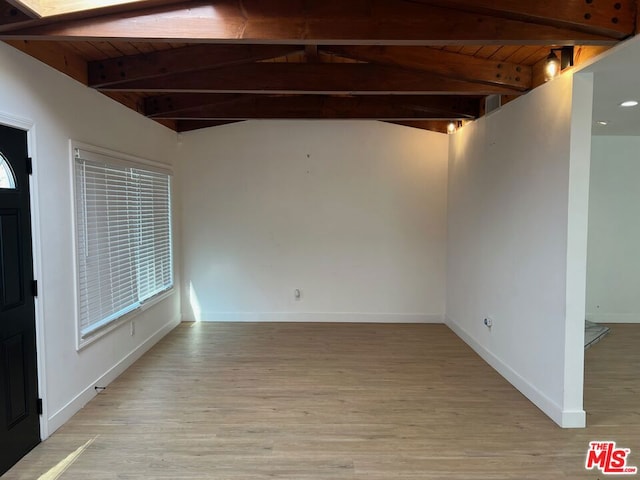 interior space featuring wood ceiling, light hardwood / wood-style flooring, and lofted ceiling with beams