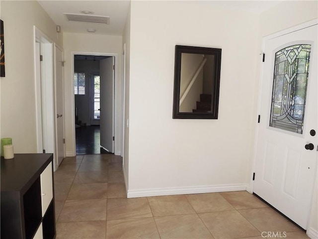 foyer entrance featuring light tile patterned floors