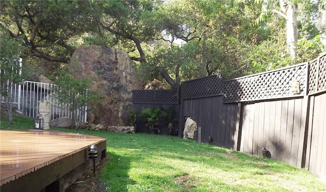 view of yard featuring a wooden deck