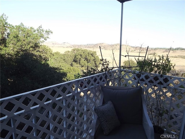 balcony featuring a rural view