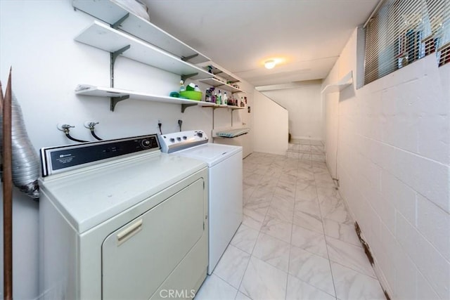 clothes washing area with independent washer and dryer