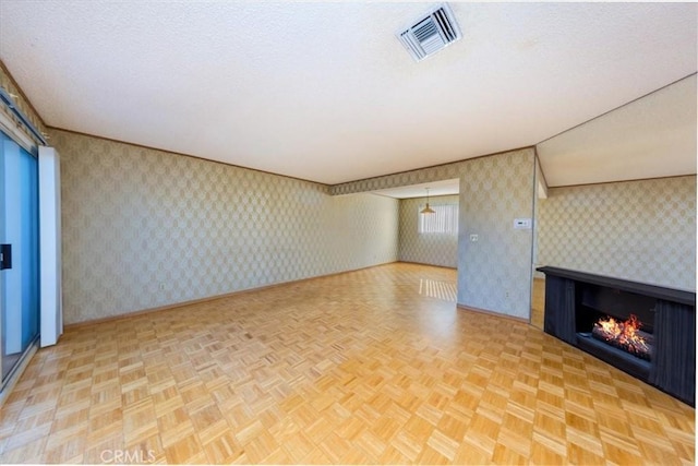 unfurnished living room with light parquet floors