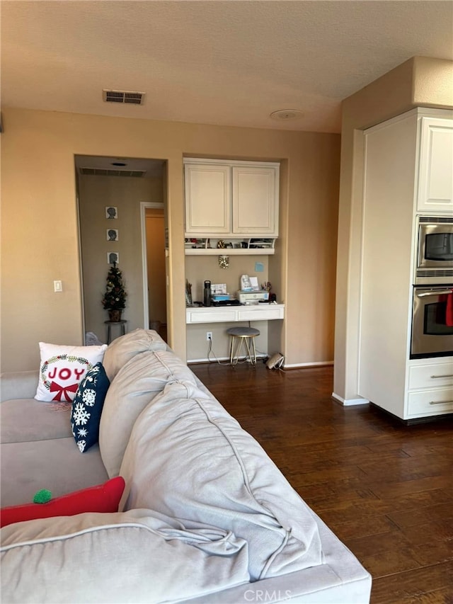 living room featuring dark hardwood / wood-style flooring