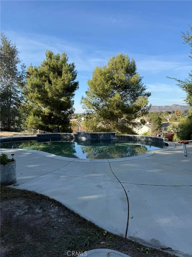 view of pool featuring a mountain view