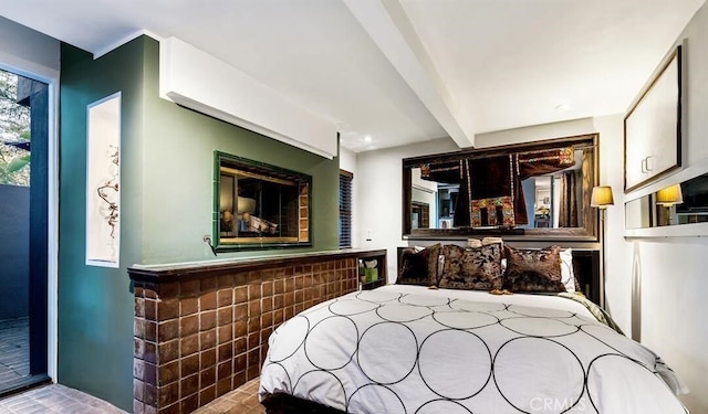 bedroom featuring beam ceiling