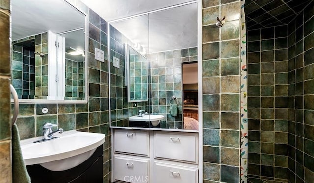 bathroom with vanity and tile walls