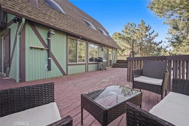 wooden deck with grilling area