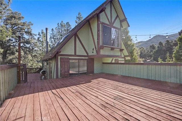 wooden deck with a mountain view