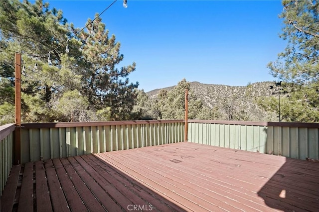 wooden terrace with a mountain view