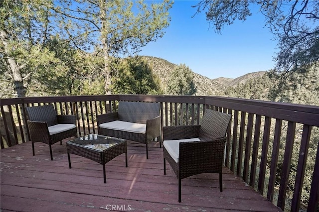 wooden terrace featuring a mountain view