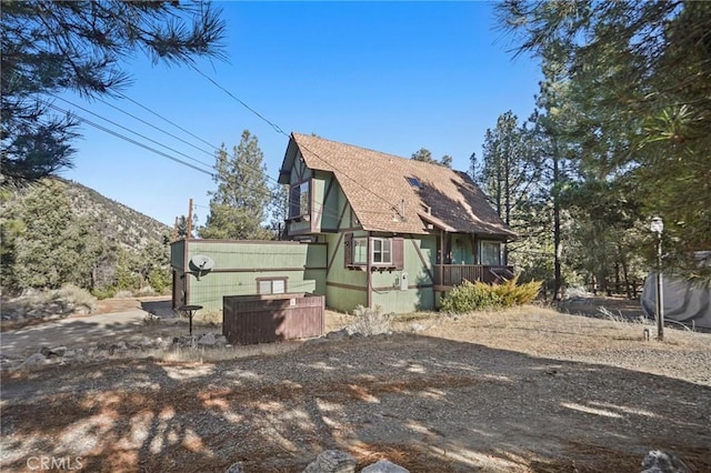 view of property exterior with a mountain view