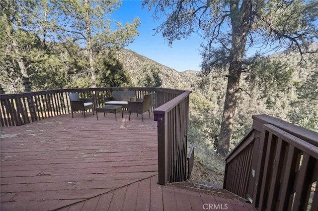 wooden terrace with a mountain view