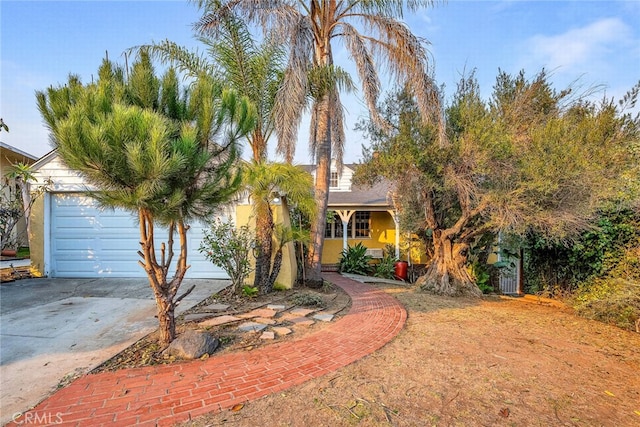 obstructed view of property with a garage