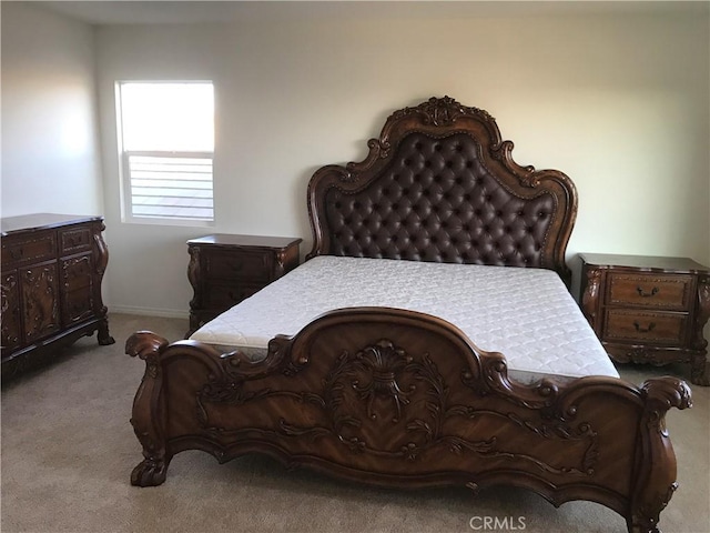 bedroom with light colored carpet