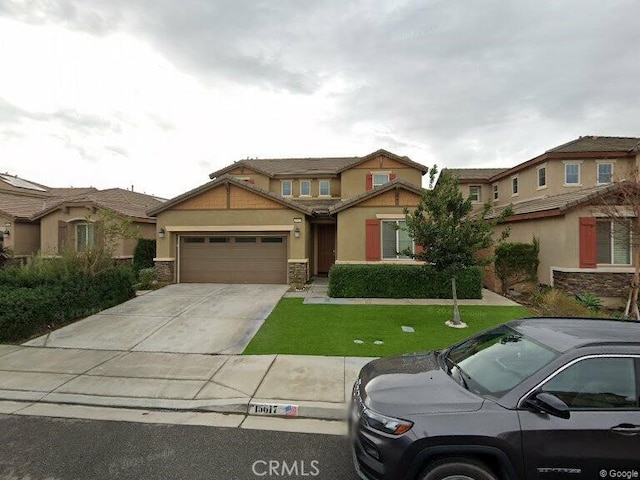 view of front of property featuring a front lawn and a garage