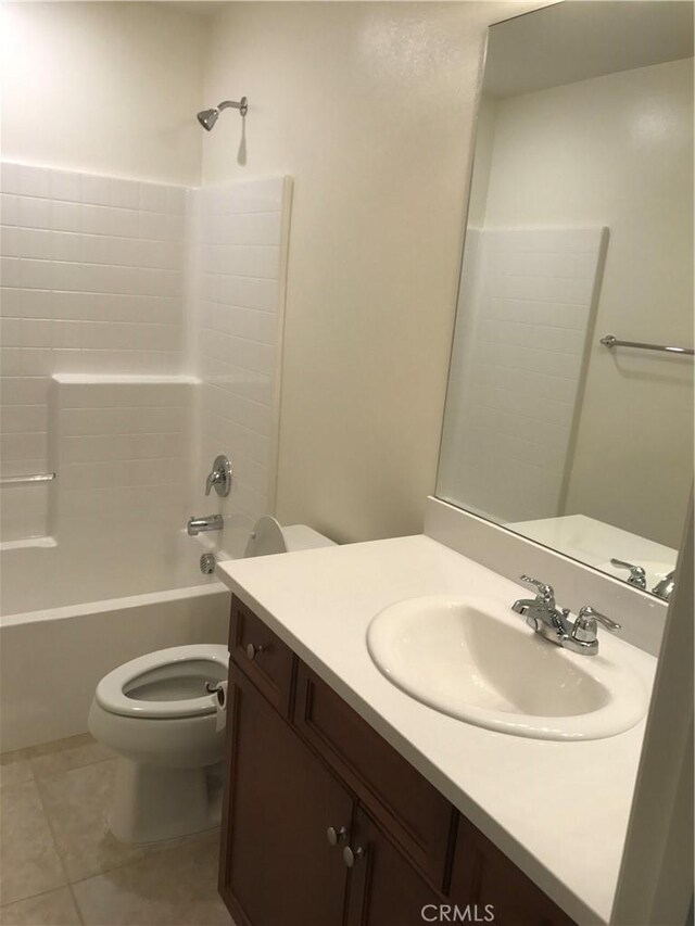 full bathroom featuring toilet, tile patterned flooring, vanity, and shower / bathing tub combination