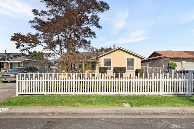 ranch-style home with a front lawn